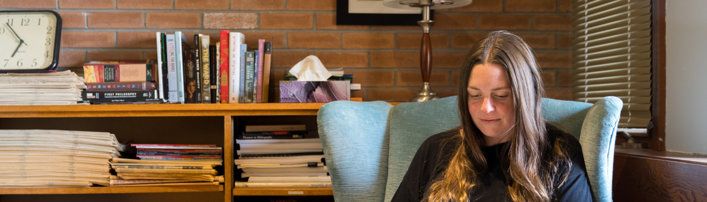 graduate student reading a book
