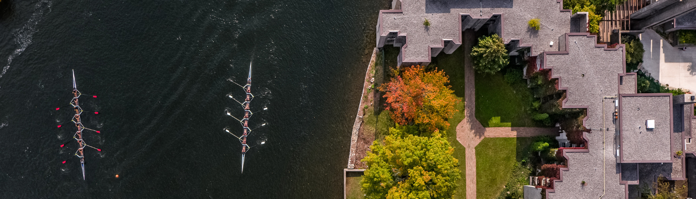 aerial of a river with rowers