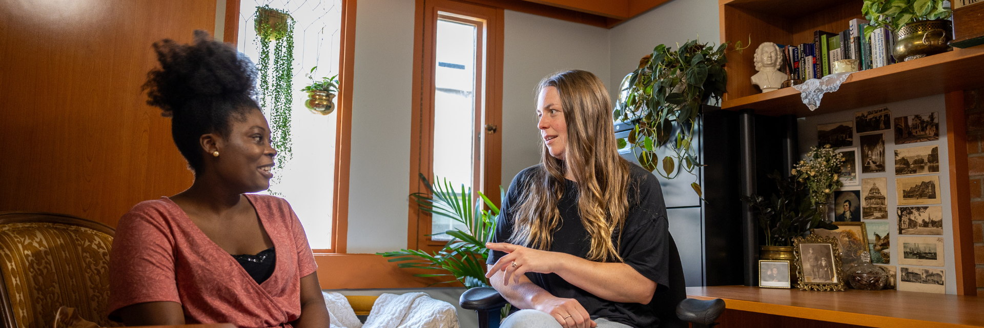 Two women having a conversation in an office