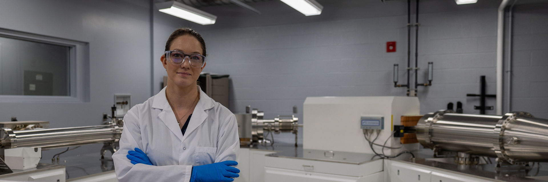 Scientist in lab with arms crossed