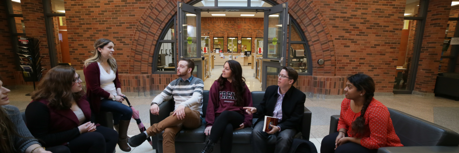 Students and faculty sitting outside Trent Durham GTA  library