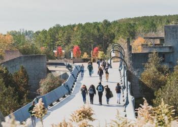 Students walking over Faryon bridge