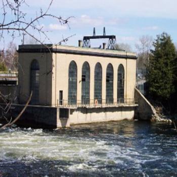 Outside view of the brick power station building with raging waters surrounding it
