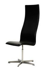 Black leather chair with a high back and no arm rests on swivel metallic base  