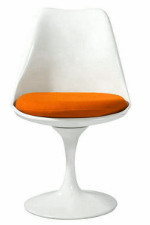 White chair with slender base the widens at the seat then conclaves with a orange pillow as a seat