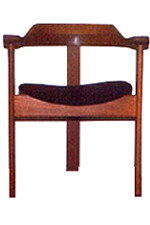 Three legged wooden chair with a leather seat and a open back and armrests