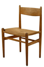 Four legged wooden chair with an open back and no arm rests