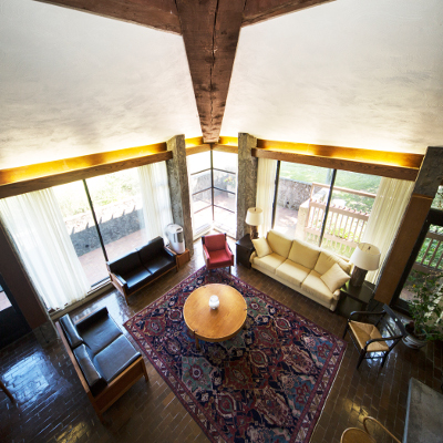 Interior of the Alumni House's main lounge area with original furniture from Ron Thom