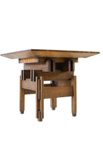 All wood table made of several interlocking pieces providing several protruding edges and giving it a layered  or stacked appearance 