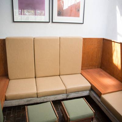 Re-mastered beige cushions for a long leather couch with high backing and short seating