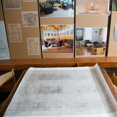 Coloured photos of Trent in the 1970's with the original Ron Thom furniture on display.