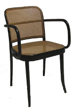 Thin black metal frame with four legs and curved slim armrests with a light brown mesh seat and backing