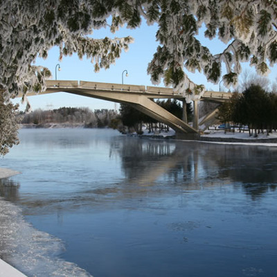 Exterior of Faryon bridge in the winter with snow on the bridge and tree's surrounding