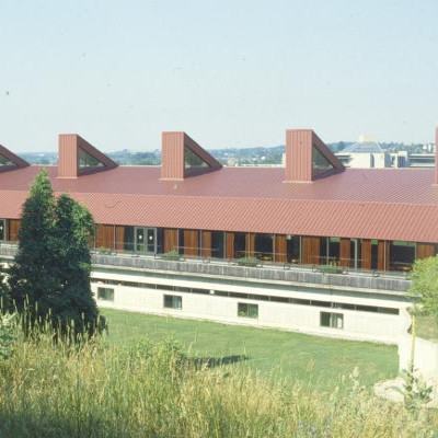 Exterior image of Otonabee wiith focus on its backing and the forestry that follows
