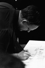 Black and white photo of Ron Thom working on designs