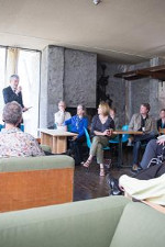 Coloured photo of the opening of the new season spoon with people sitting around listening to Rob Tuckerman.
