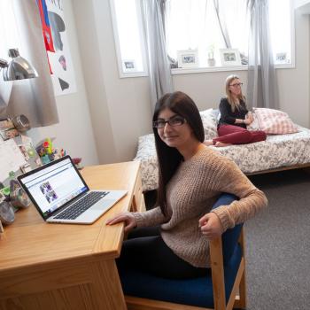 Students gather together in a residence room