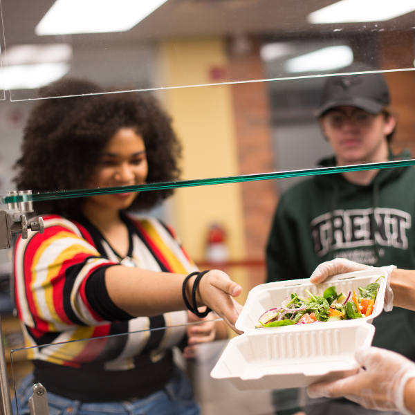Student getting a meal in dining hall.
