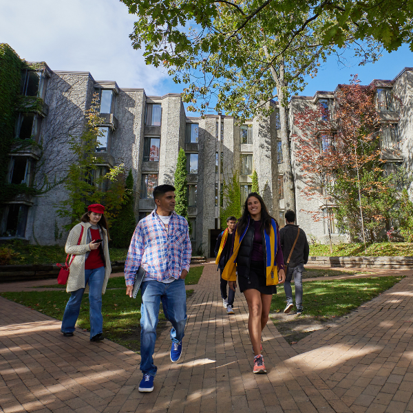 A group of students walking outside of Champlain College's residence room.