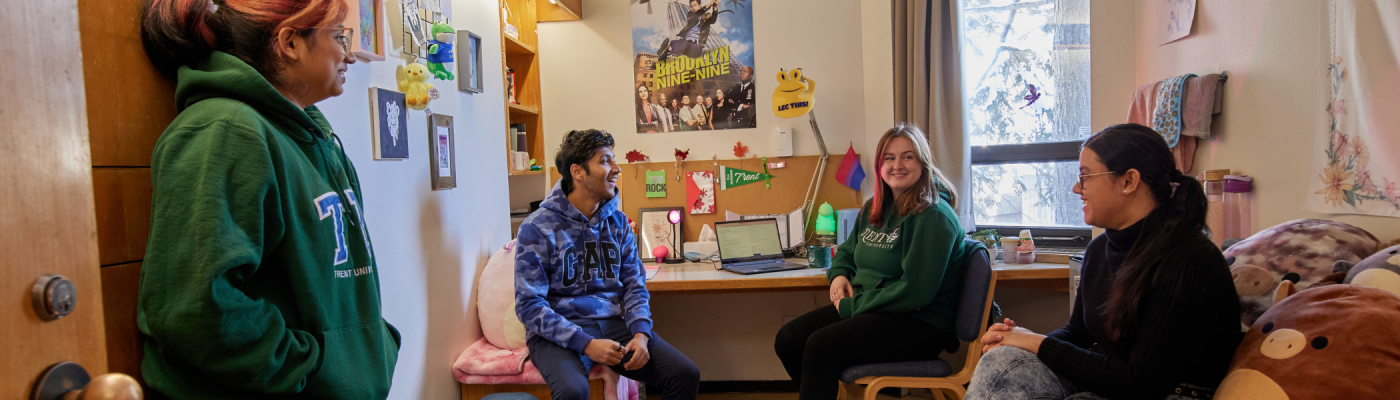 A group of students in their residence room.