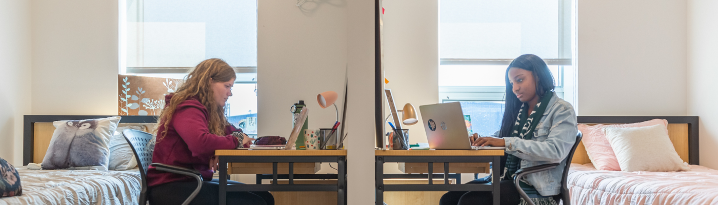 A group of students in their residence room.
