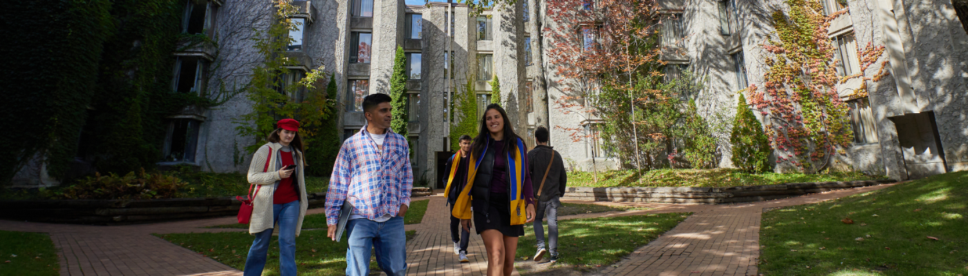 A group of students walking outside of Champlain College.