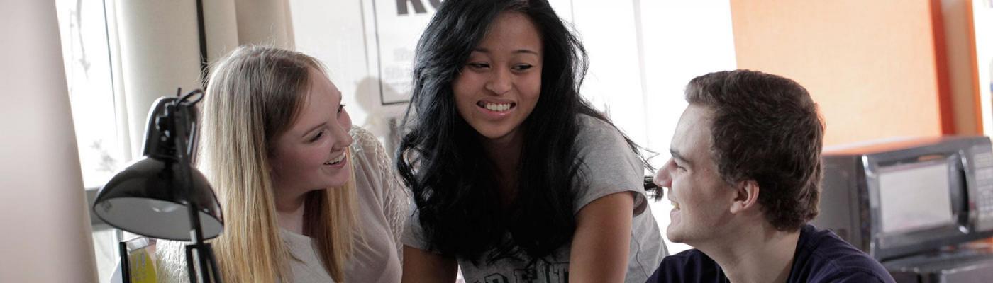 Three students in residence room