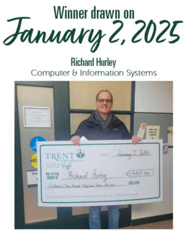 Employee holding large cheque