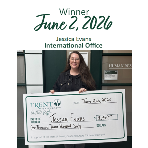 Jessica Evans holding giant cheque