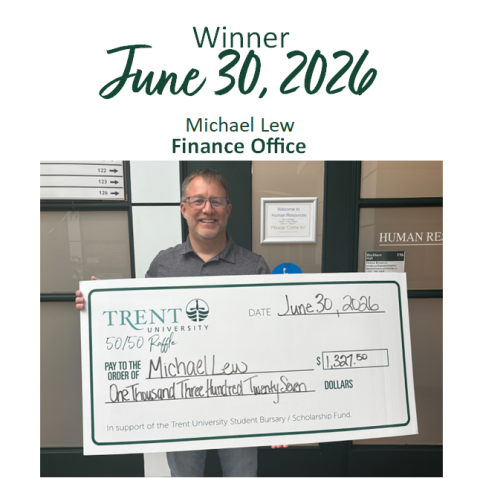 Michael Lew holding giant lottery cheque