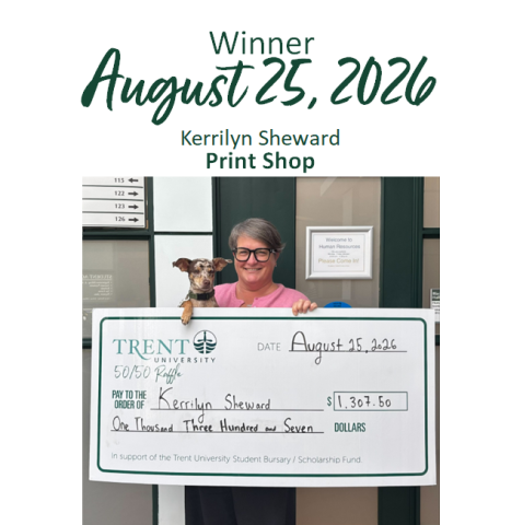 Lottery winner holding giant cheque