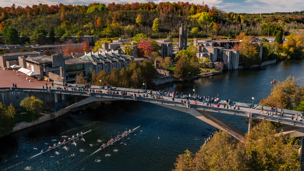 A view of Trent University showing the bridge and the river