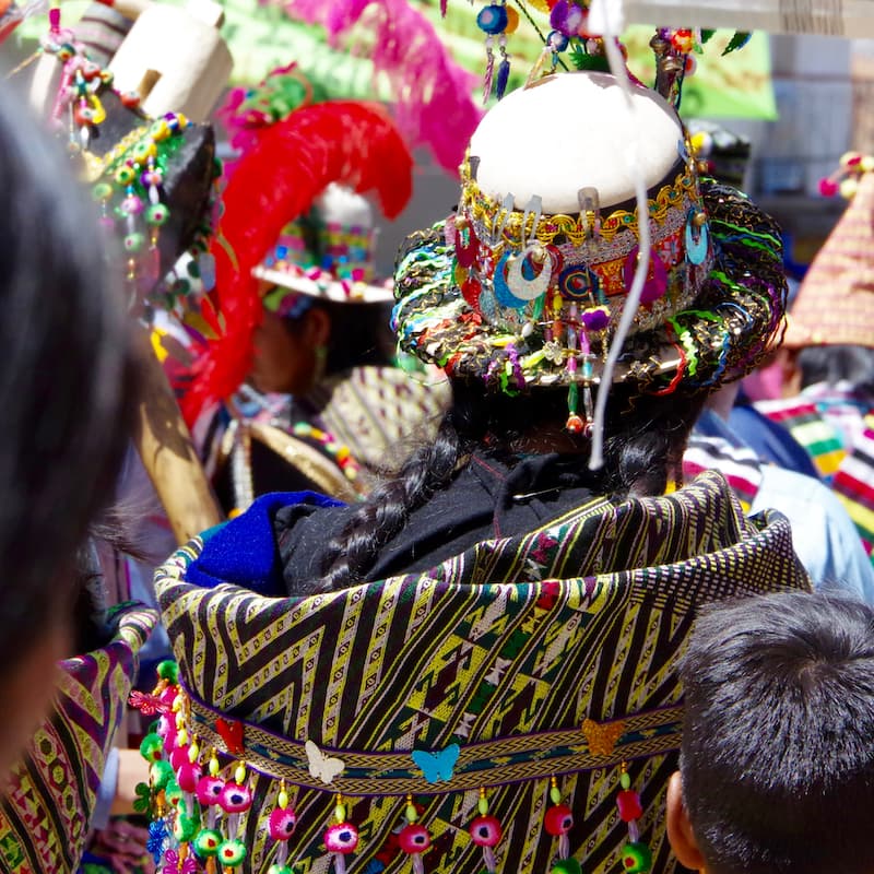 Photo of the rear of someone wearing colourful clothing in Bolivia