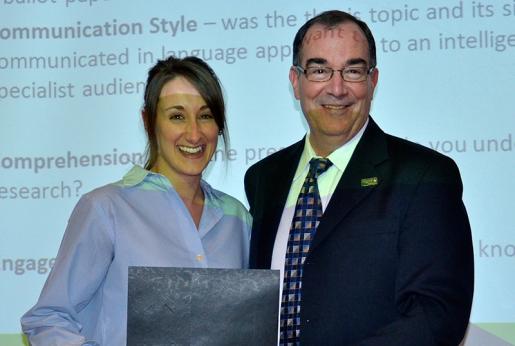 Winner Shivaan Burke accepting award from Trent President Steven Franklin