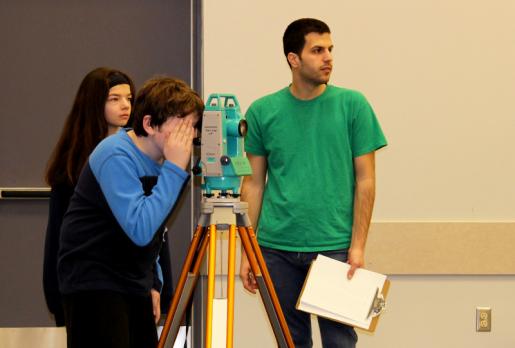 Trent Oshawa Student works with Elementary School Students on Archaeology Day