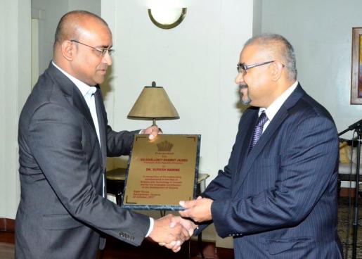Dr. Suresh Narine was presented his award by President Bharrat Jagdeo
