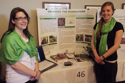 Trent students Kristin Boyd and Julie Gardner show off their community-based education project at the annual Innovation Forum