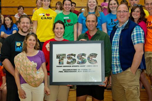 Past and present TSSC camp directors show off the 20th Anniversary Legacy Photo – a collection of iconic moments from the first 20 years of camp, created by Trent Photo. From left to right: Patrick Assinck, Melanie Sedge, Kate Pearce, Chris Kitchen and Bruce Emmerton.