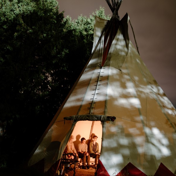 Students learning in a tipi
