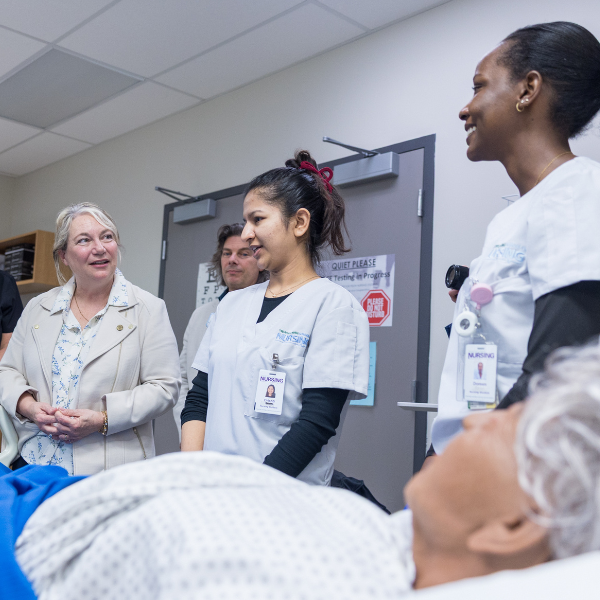 Nursing students talking to people