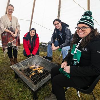 Students gathered in tipi