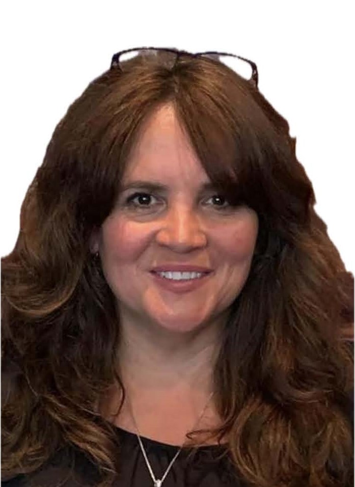 Woman with thick brown hair and heart shaped face