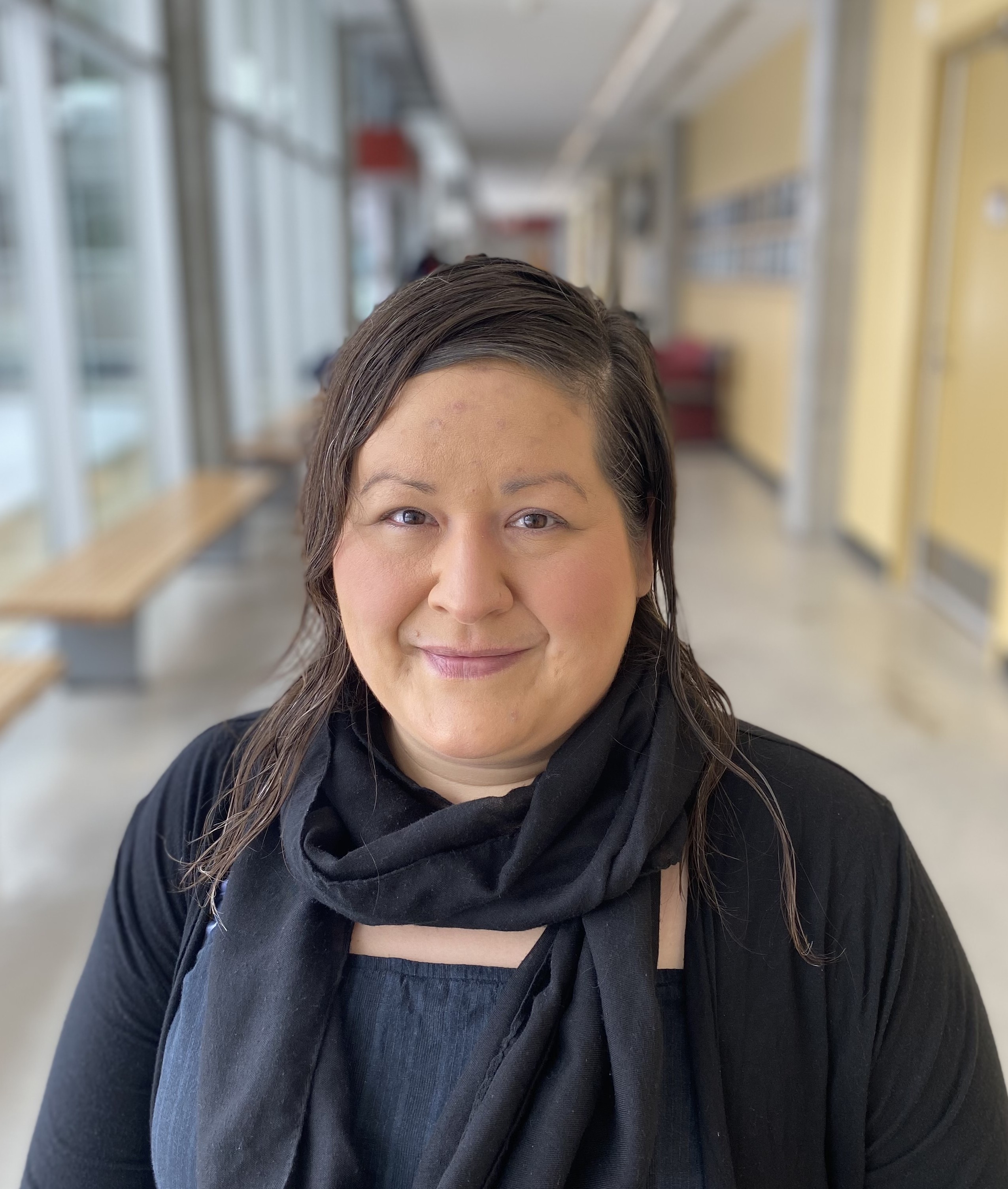 woman with black scarf around her neck