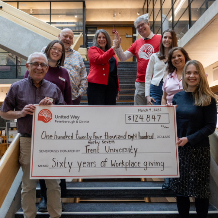 Group holding united way donation check