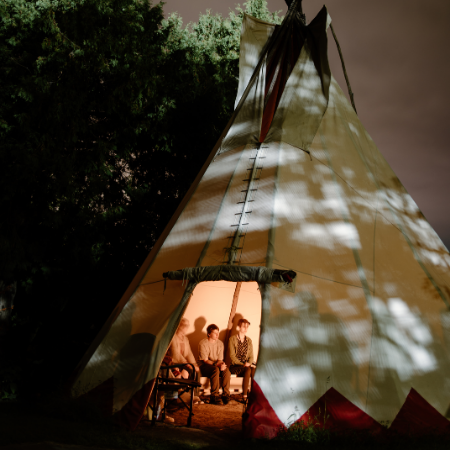 Students inside of tipi