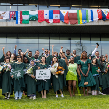Group of alumni graduating