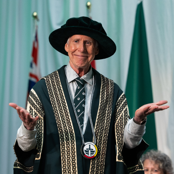 Stephen Stohn poses with his hands facing up