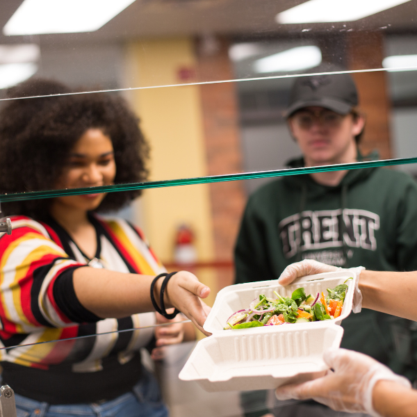 Student grabs a container of food