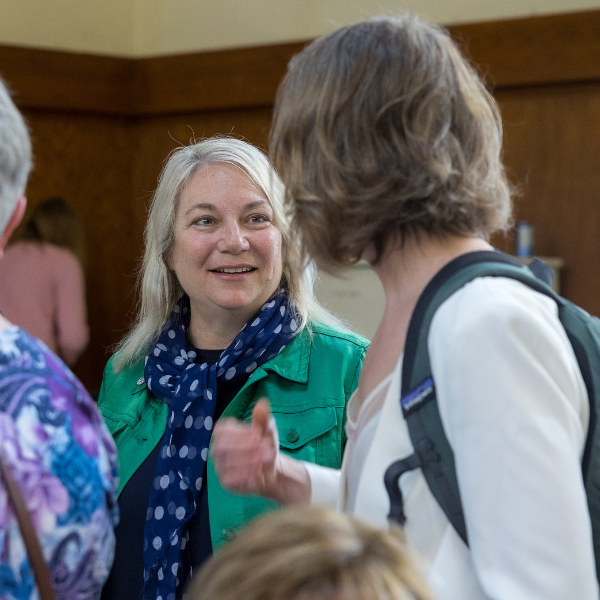 Faculty speak with each other