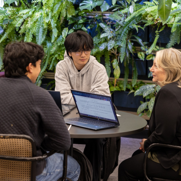 Students talking to professor